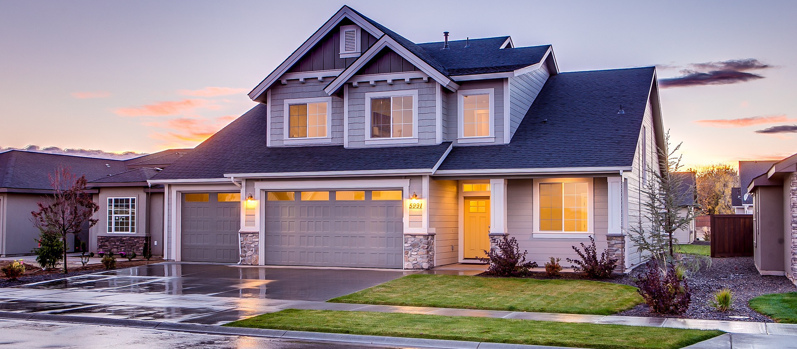 A home with a garage door sealing system